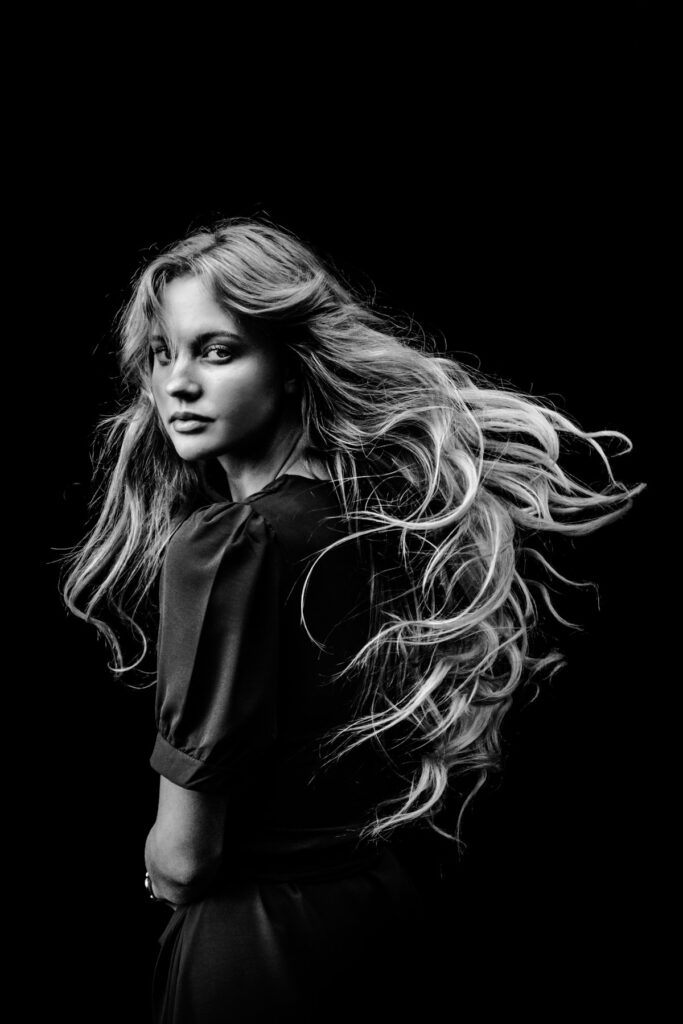 No studio, no lights, no hardware. my niece just doing a hair flip outside in front of my 